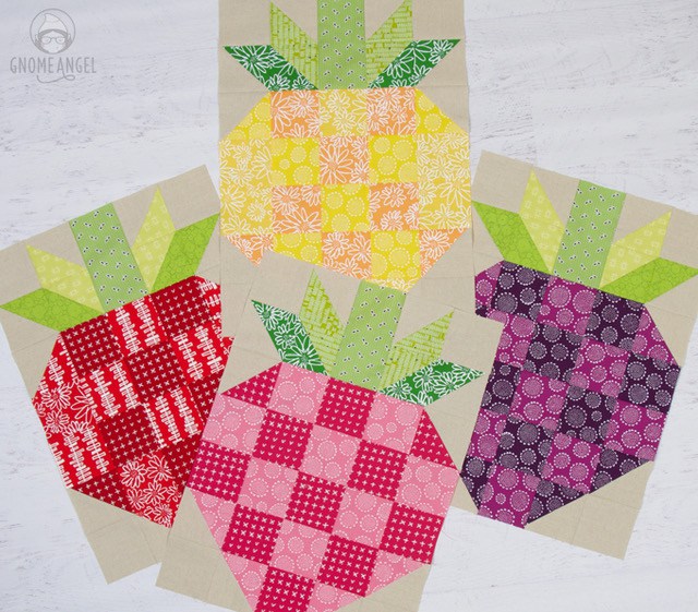 Strawberry Quilt Block - Learn to make this large strawberry quilt block on www.GnomeAngel.com - Block finished at 17.5" x 24.5" and is great for a quick large quilt finish, using up your scraps and having fun with colour. Perfect summer quilt. This version is made featuring Karen Lewis Blueberry Park for Robery Kaufman partnered with Robert Kaufman Essex Linen. See more at www.GnomeAngel.com